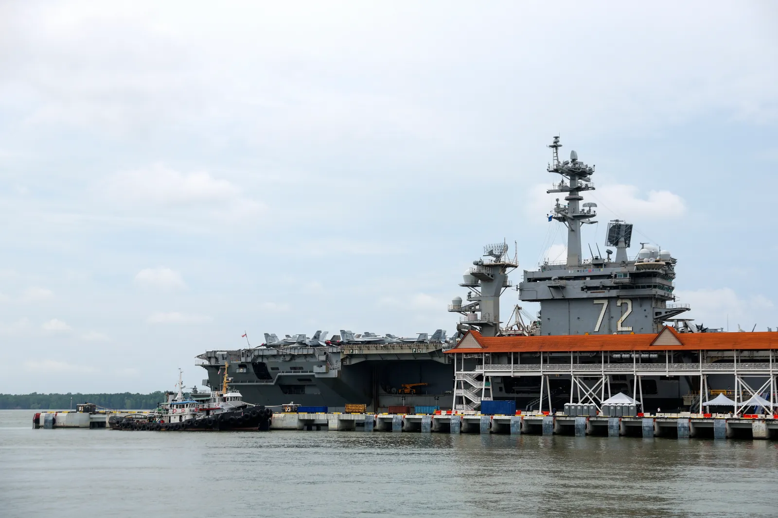 The Nimitz-class aircraft carrier USS Abraham Lincoln is docked during a media tour in Port Klang, on the outskirts of Kuala Lumpur, Malaysia, on November 26, 2024. | Fazry Ismail/Pool Photo via AP
