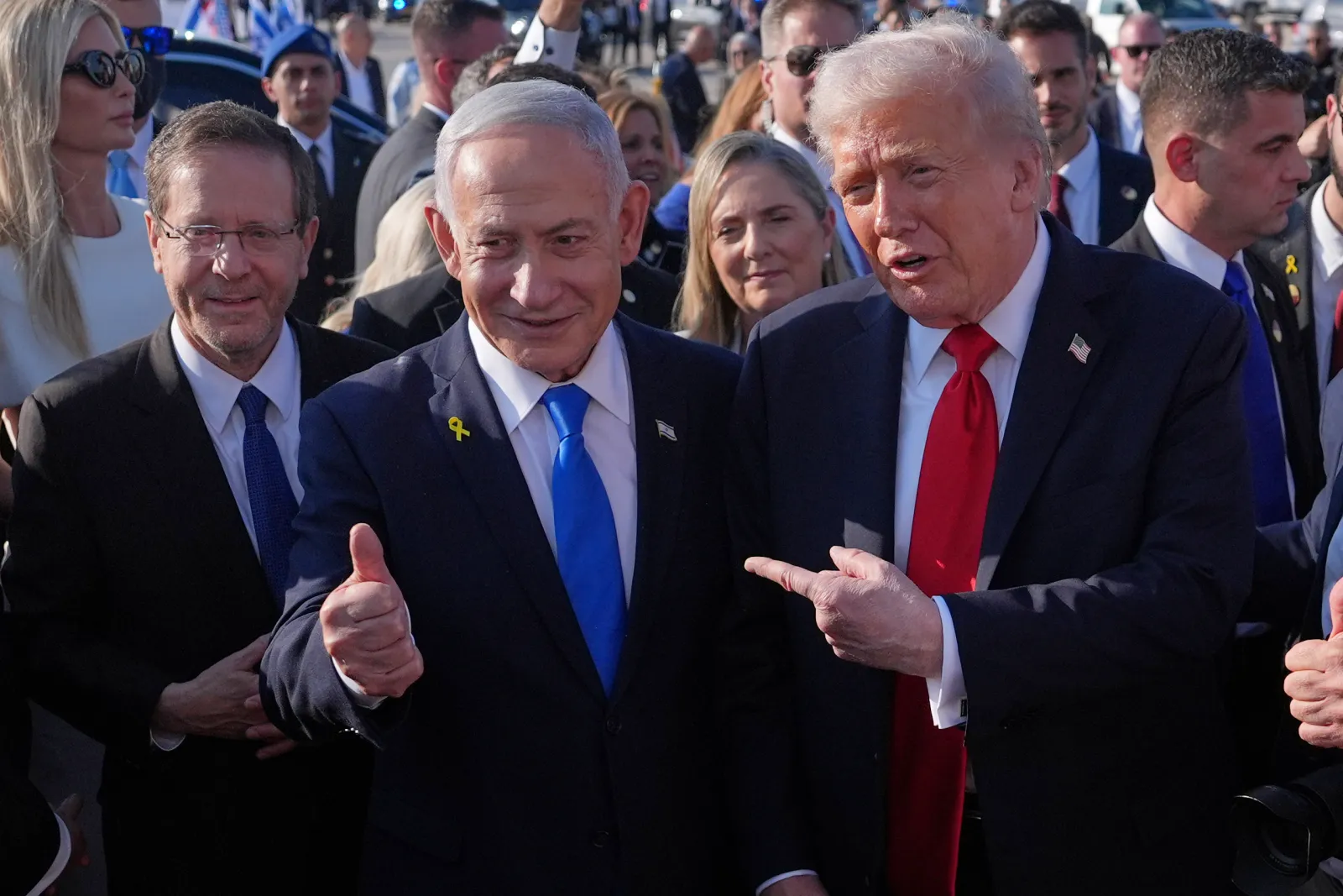 President Donald Trump poses for a photo with Israel's Prime Minister Benjamin Netanyahu before he boards Air Force One at Ben Gurion International Airport on October 13, 2025, near Tel Aviv. (AP Photo/Evan Vucci)
