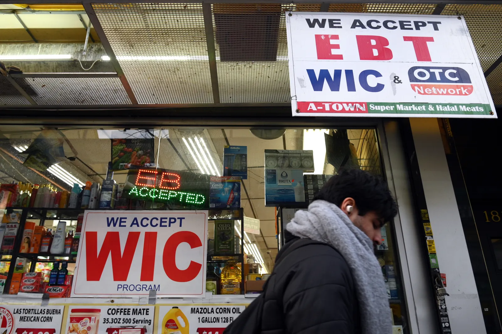 A store displays a sign accepting Electronic Benefits Transfer (EBT) cards for Supplemental Nutrition Assistance Program (SNAP) purchases for groceries, in Brooklyn, New York, on January 2. (Photo by Anthony Behar/Sipa USA)(Sipa via AP Images)