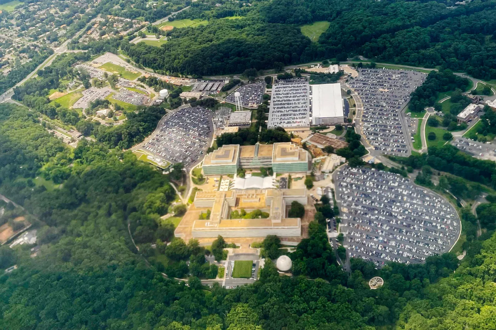The Central Intelligence Agency (CIA) headquarters is seen from a commercial airliner as it files over the CIA campus in Langley, Virginia, on July 24, 2023. (AP Photo/Pablo Martinez Monsivais, File)