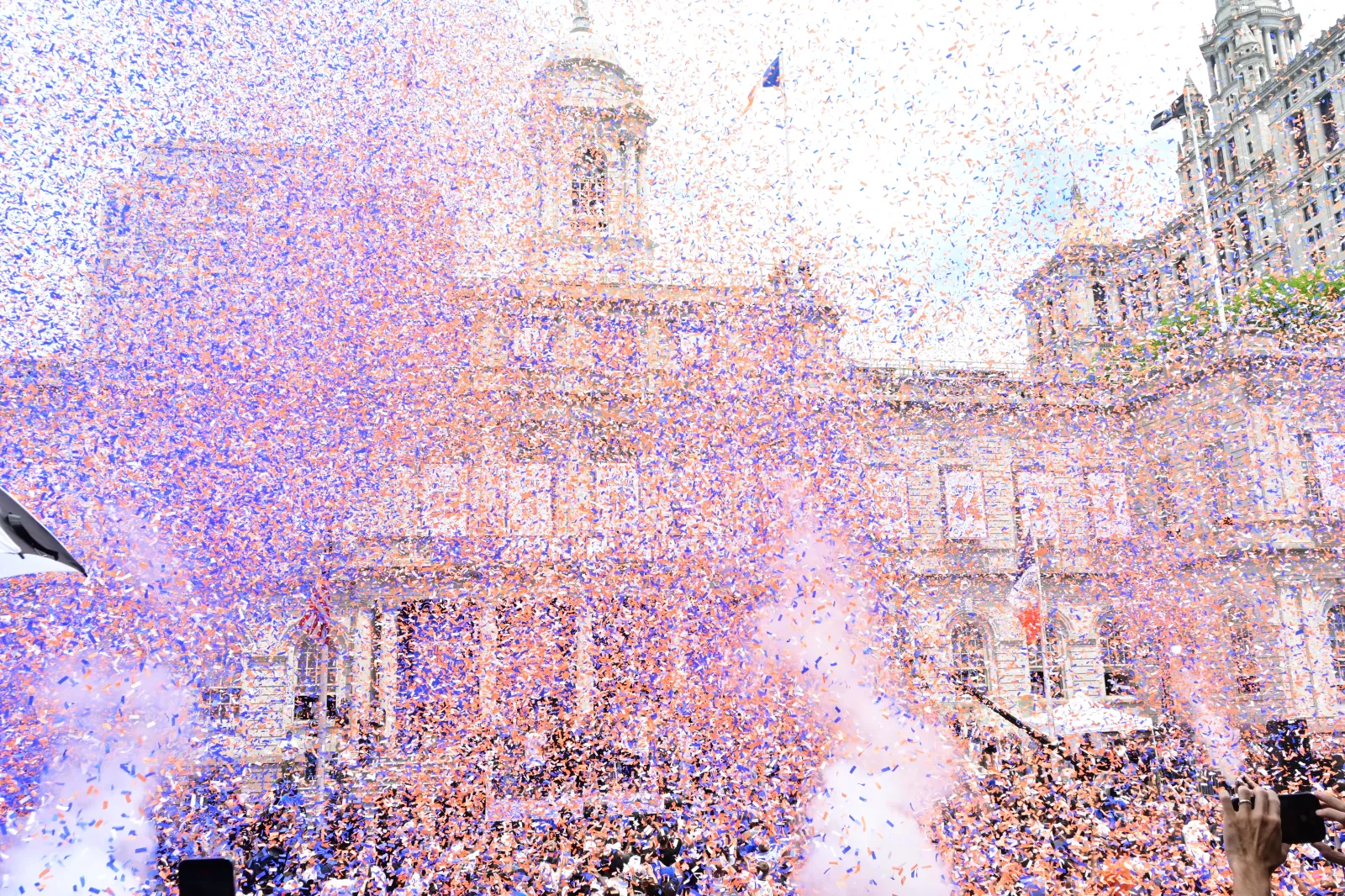 Confetti and cheers fill the Lower Manhattan skies at the New York Knicks' ticker-tape parade on June 18 in New York City. (Andrea Renault/STAR MAX/IPx)