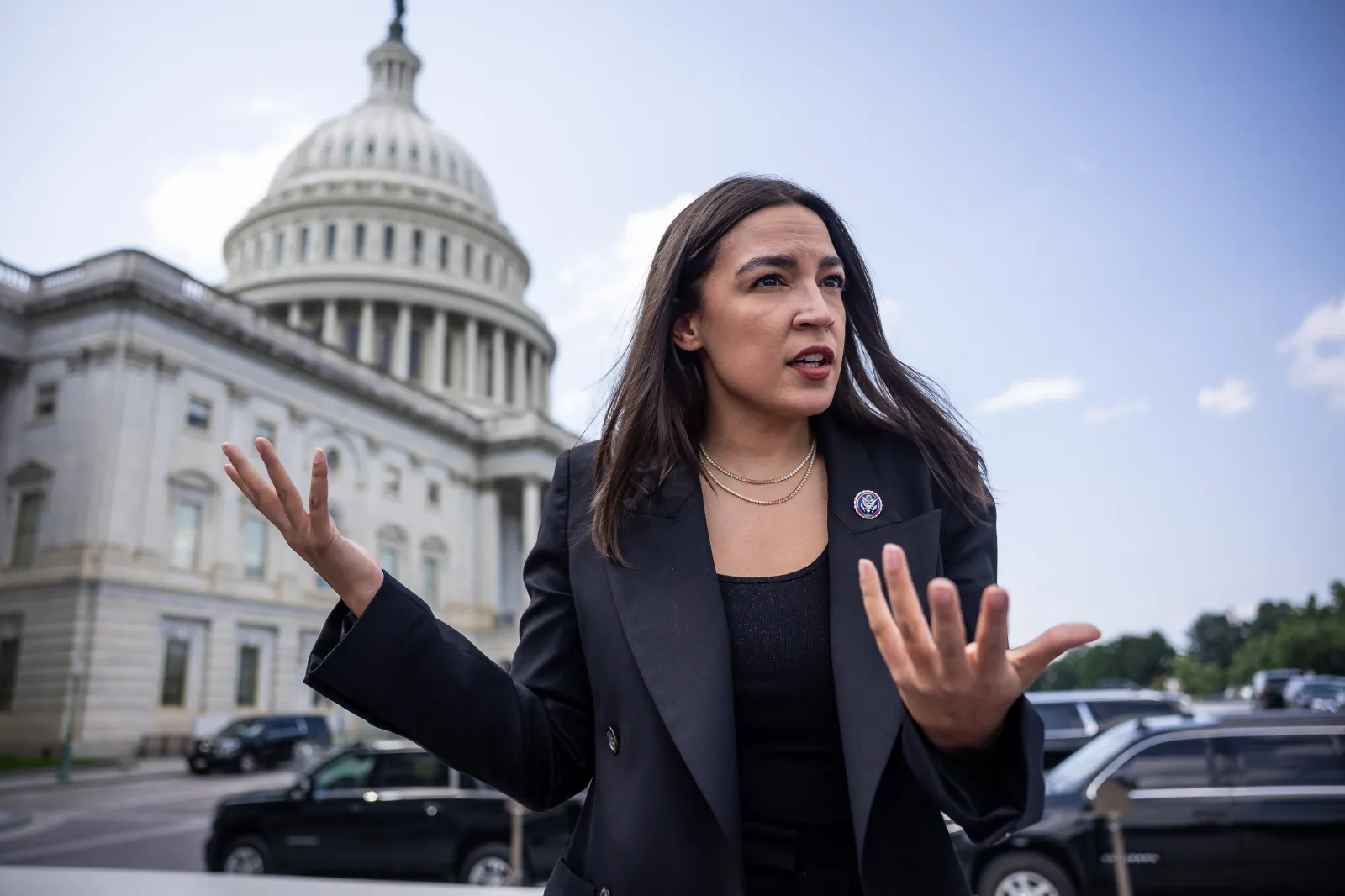 Rep. Alexandria Ocasio-Cortez (D-N.Y.) speaks with reporters as she arrives for a vote at the U.S. Capitol on July 22, 2026.