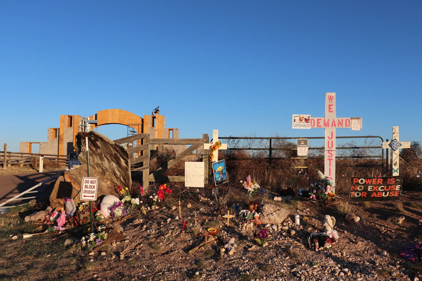 Crosses, flowers and other mementos are displayed outside Jeffrey Epstein's former Zorro Ranch near Stanley, N.M., on Friday, April 3, 2026. (AP Photo/Savannah Peters)