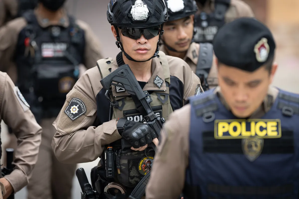 Police officers secure Debsirin Nonthaburi School, where a shooting killed several people in Thailand's Nonthaburi province, Friday, Aug. 7, 2026.