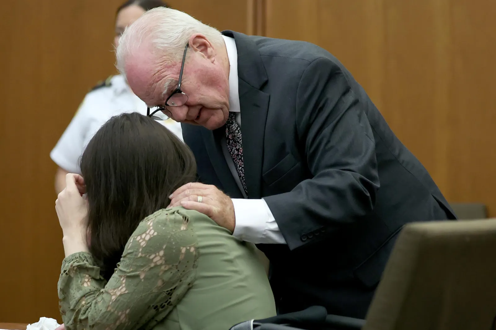 Defense attorney Kevin Reddington consoles his client, Lindsay Clancy, as she sobs during her murder trial at Plymouth Superior Court in Plymouth, Mass., Wednesday, Aug. 12, 2026. (Mark Stockwell/Boston Herald via AP, Pool)