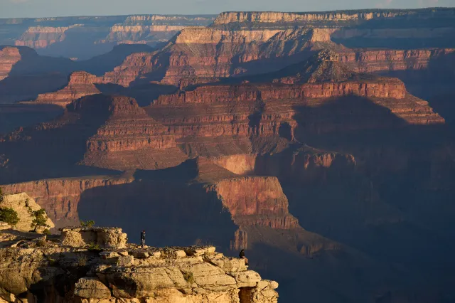 People stand at the rim of the Grand Canyon on August 31, 2026, in Grand Canyon National Park, Arizona.