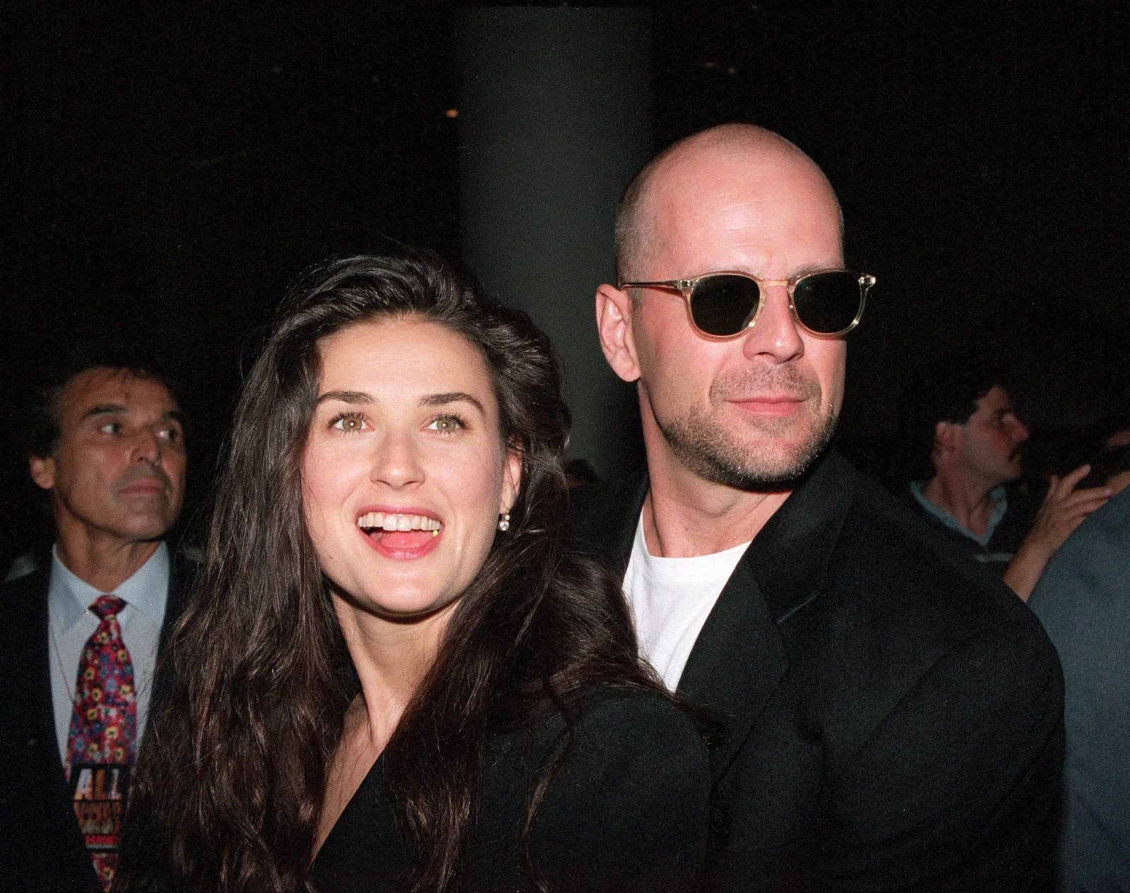 Husband and wife actors Bruce Willis and Demi Moore, left, arrive at the premiere of the movie "Die Hard With a Vengeance," at the Sony Lincoln Square Theater in New York City on May 15, 1995.