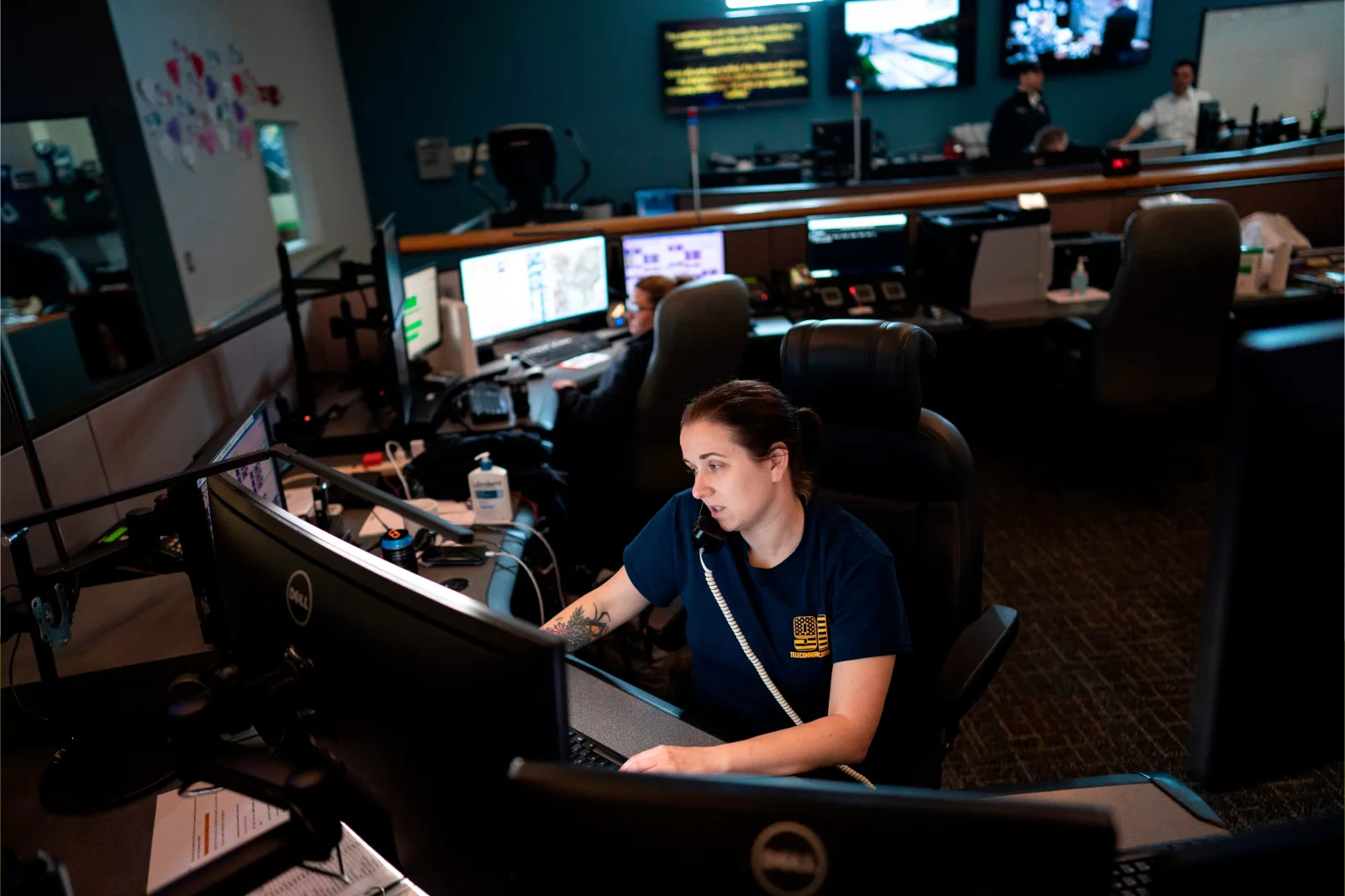 A dispatcher Fire Department answers a 911 emergency call from their department dispatch center in Glen Burnie, Maryland in 2020.