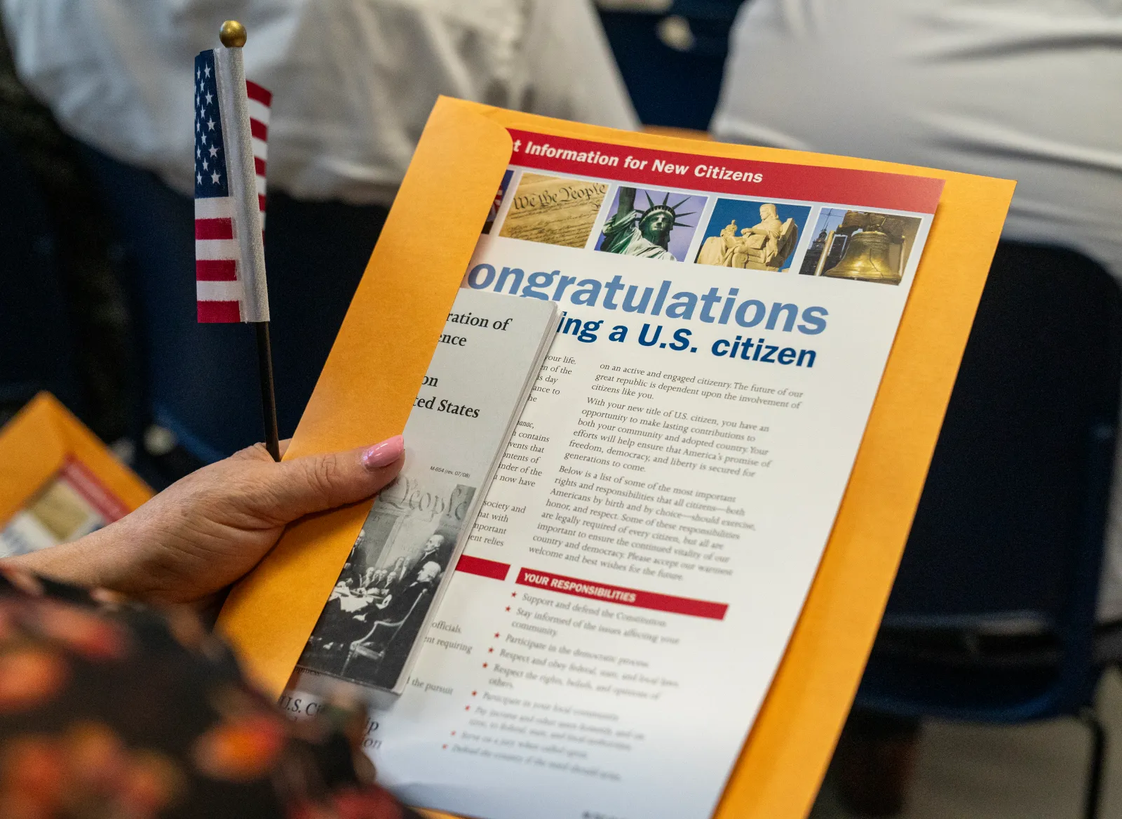 Candidates for U.S. citizenship sit before receiving their certificates of naturalization during a formal ceremony on June 4, 2025, in the Manhattan borough of New York City.