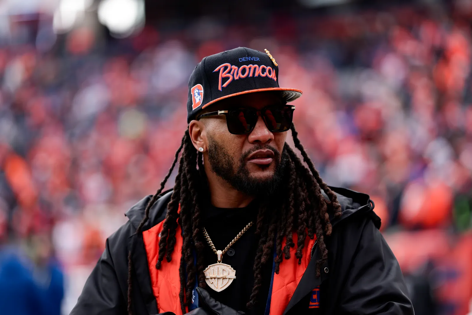 NFL alumni T.J. Ward of the Denver Broncos stands on the field before the AFC Championship Playoff game between the New England Patriots and the Denver Broncos at Empower Field At Mile High on January 25, 2026 in Denver, Colorado. (Photo by Kara Durrette/Getty Images)