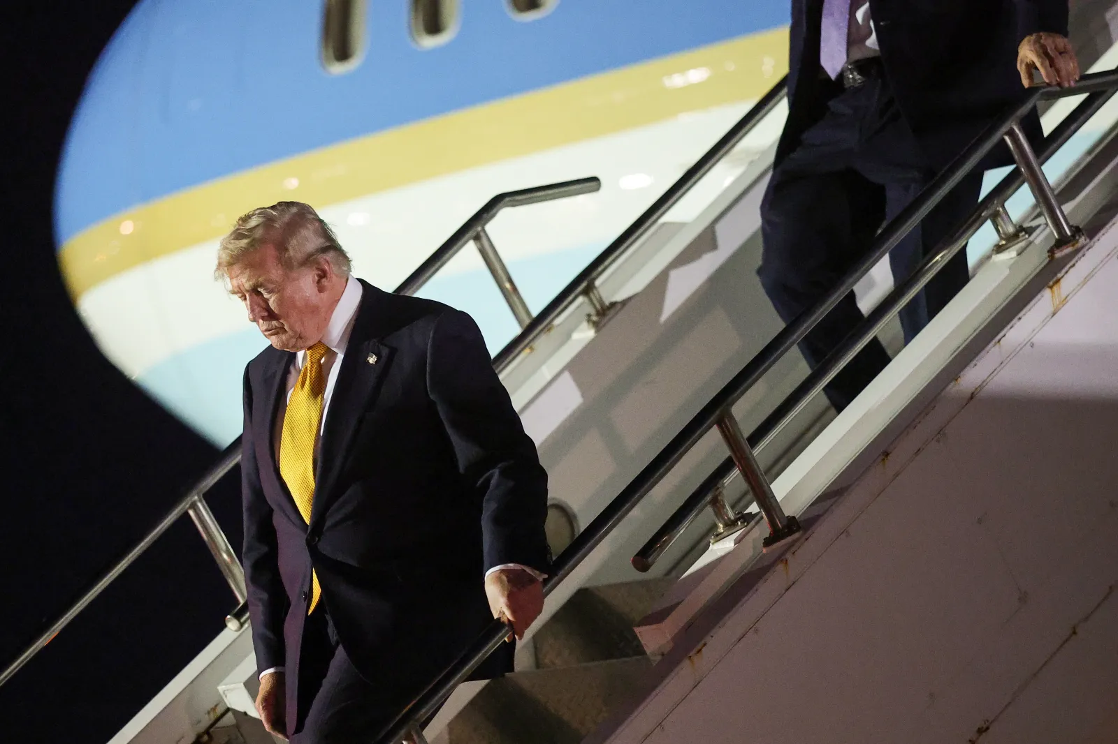 President Donald Trump departs Air Force One to board the Qatari-gifted Boeing plane, en route to the United States following his participation in the NATO Summit, on July 8 in Mildenhall, England. (Photo by Win McNamee/Getty Images)