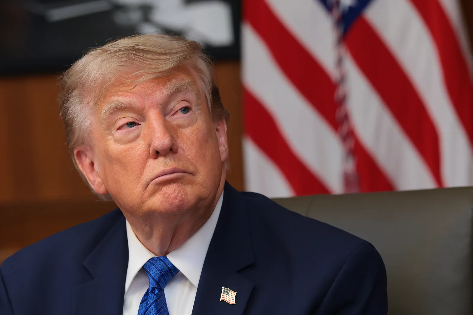 President Donald Trump listens to questions from reporters in Camp David, Maryland on July 31.