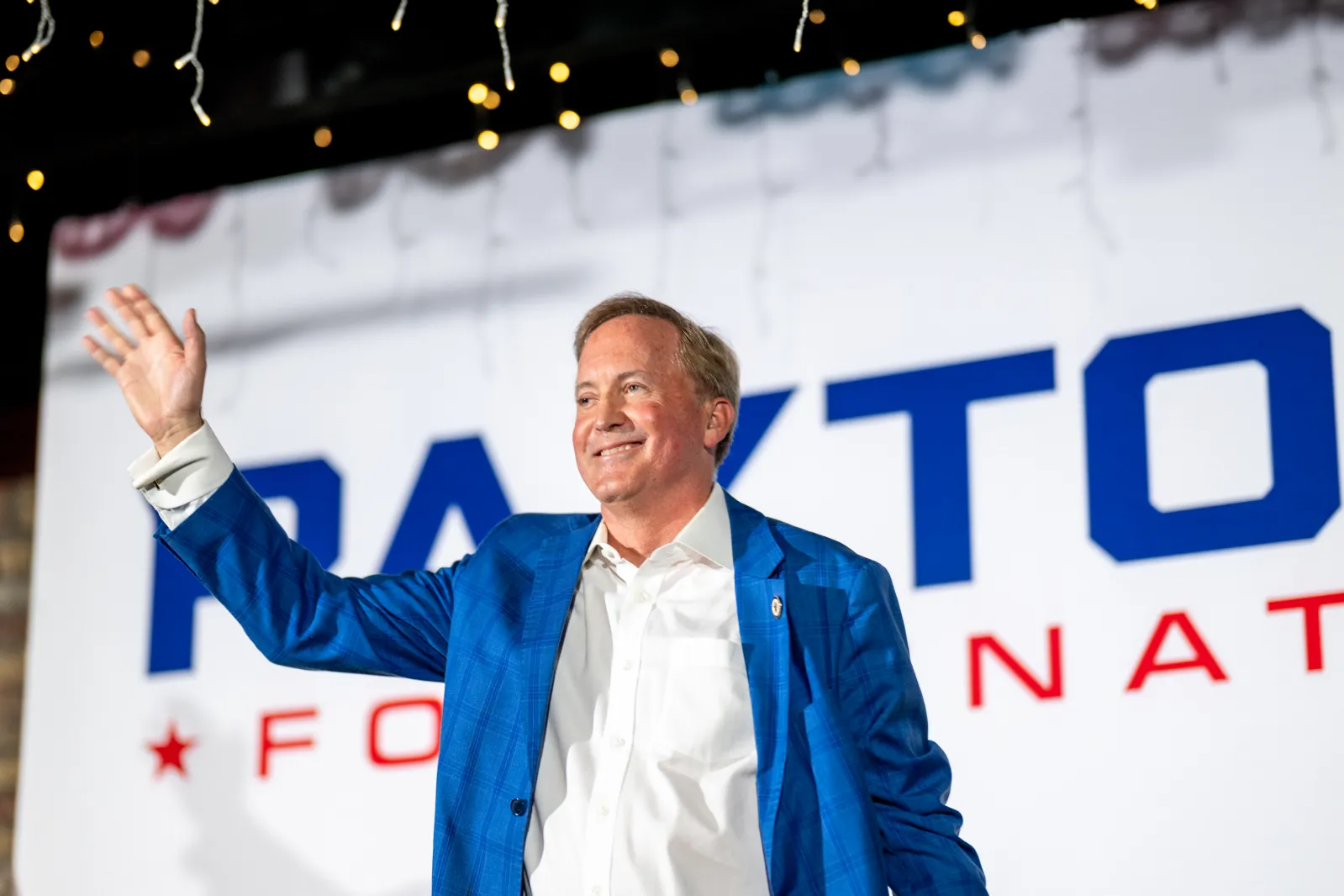 Texas Attorney General Ken Paxton waves at the conclusion of a campaign event on August 4 in Allen, Texas. (Photo by Brandon Bell/Getty Images)