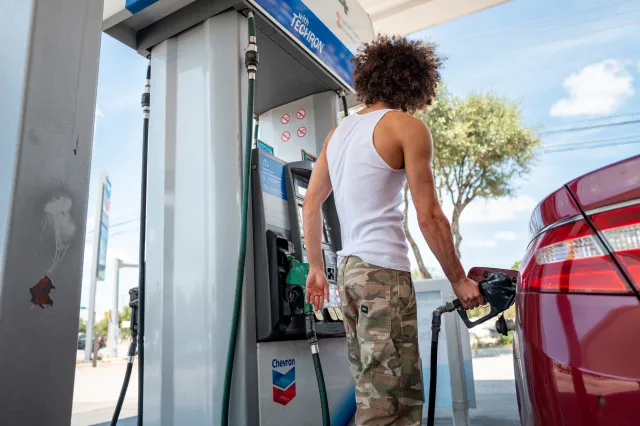 File photo: a person pumps gas at a Chevron gas station on August 7, 2026 in Austin, Texas.