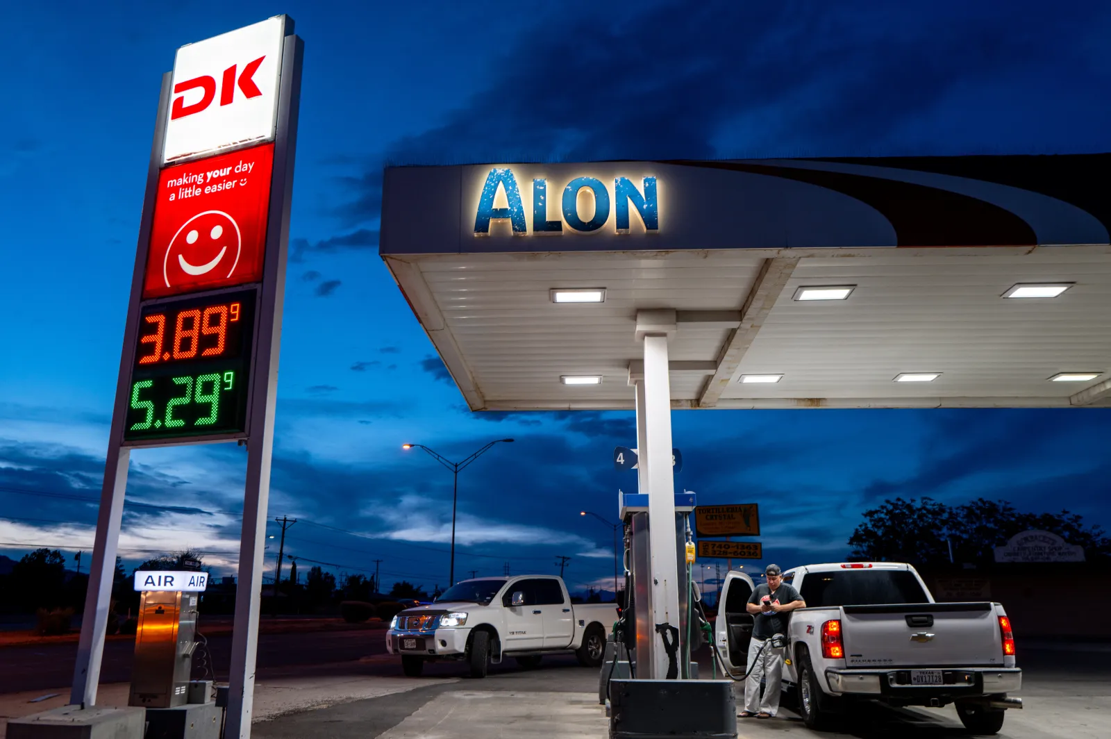 A person pumps diesel at a Alon gas station on August 13, 2026 in El Paso, Texas.