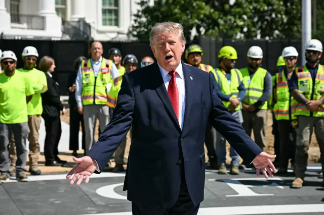 US President Donald Trump speaks to the press at the construction site of a helipad on the South Lawn of the White House in Washington, DC, on August 19, 2026. (Photo by Jim WATSON / AFP via Getty Images)