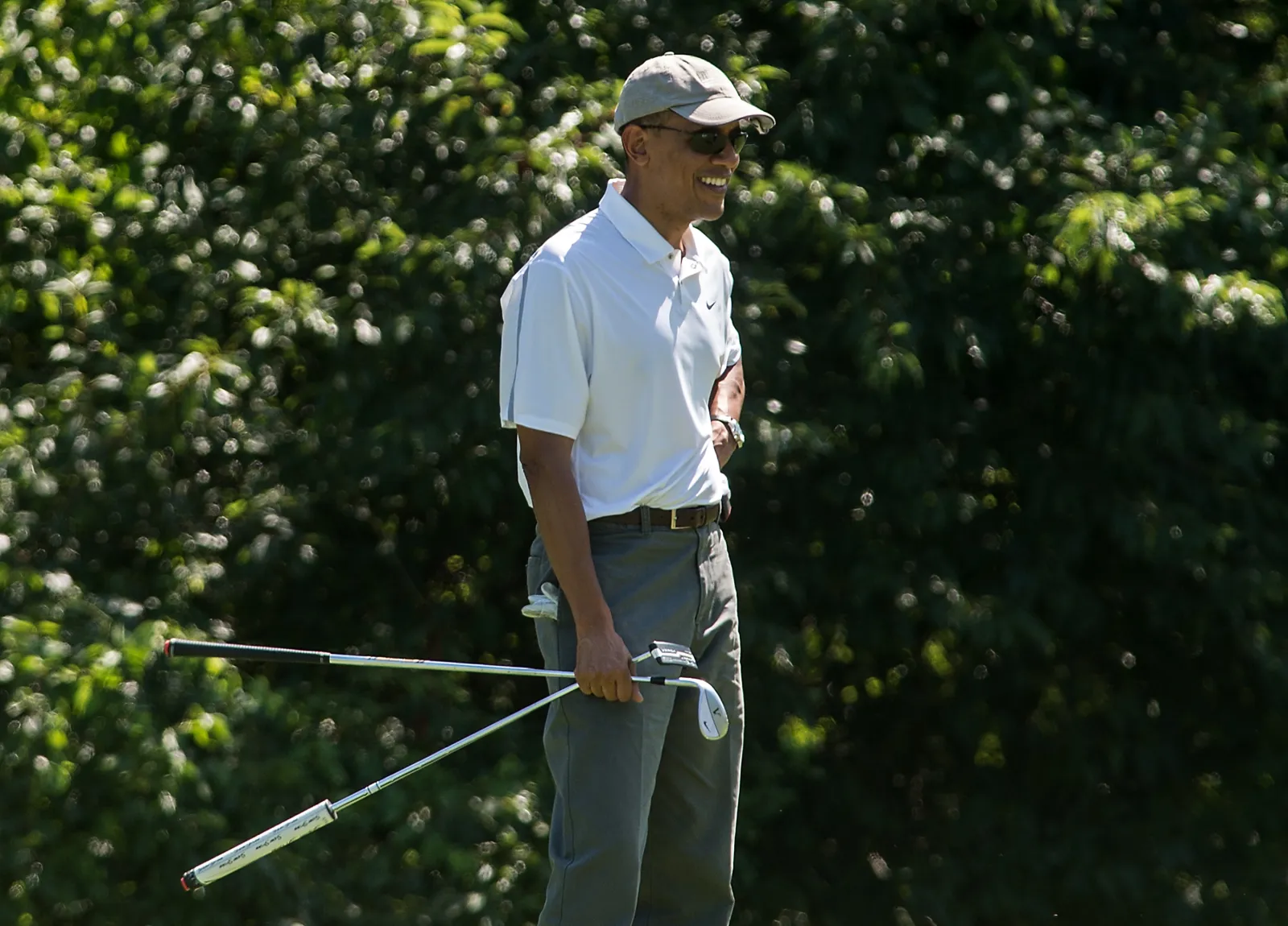 Then-President Barack Obama golfing at the Farm Neck Golf Club at Martha's Vineyard, Massachusetts, on August 9, 2014.