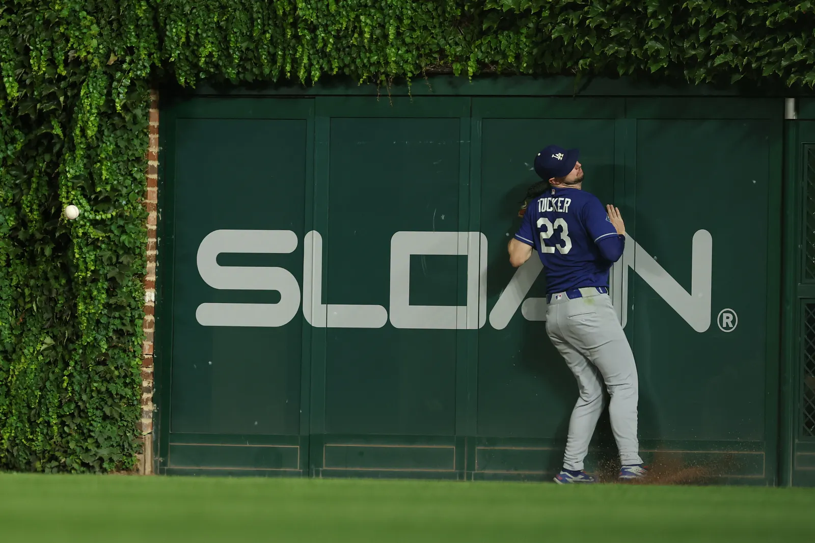 Kyle Tucker #23 of the Los Angeles Dodgers can't catch a ball hit for a double by Alex Bregman #3 of the Chicago Cubs (not pictured) during the sixth inning at Wrigley Field on August 04, 2026 in Chicago, Illinois. (Photo by Michael Reaves/Getty Images)