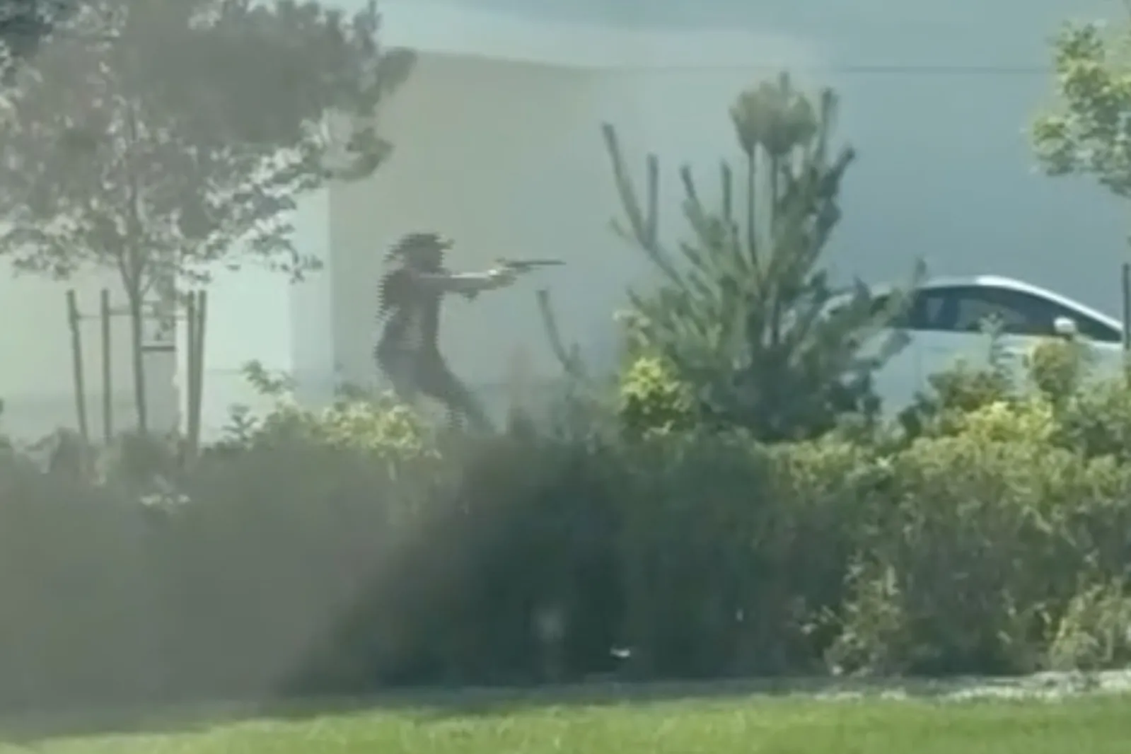 A still image captured by a witness shows Jordan Salinas firing at the gunman outside an In-N-Out Burger in Twin Falls, Idaho.