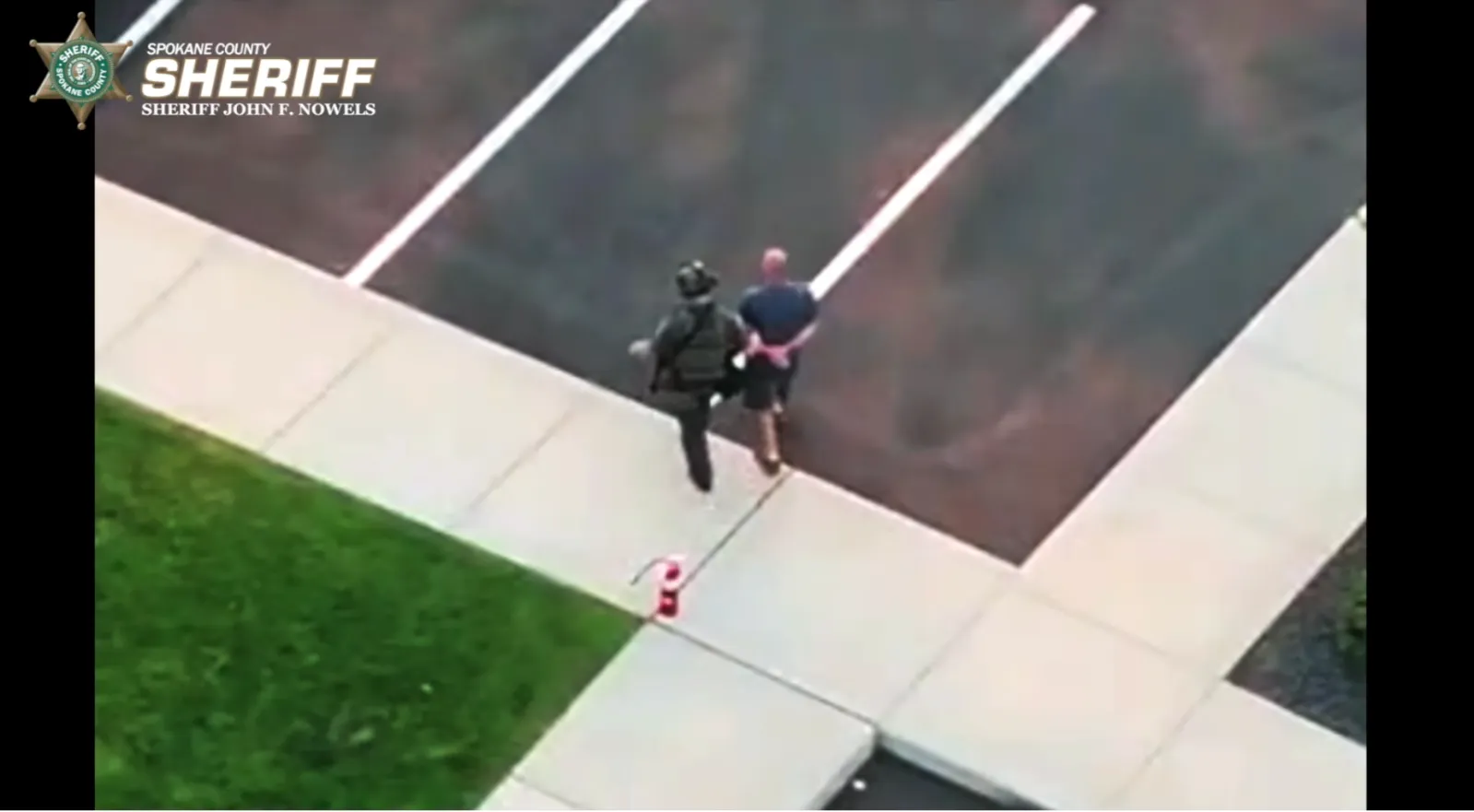 Aaron F. Farinacci being arrested by police.