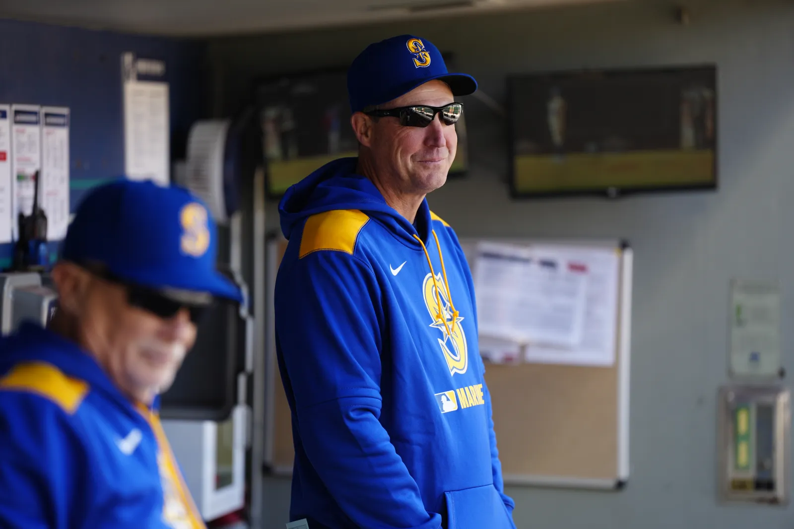 Manager Dan Wilson #6 of the Seattle Mariners watches from the dugout during a game against the Texas Rangers at T-Mobile Park on April 13, 2025 in Seattle, Washington.