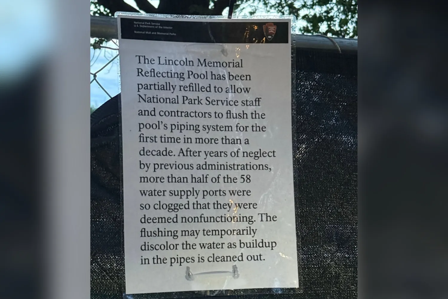 A picture of the sign seen on the Reflecting Pool on August 6, 2026.