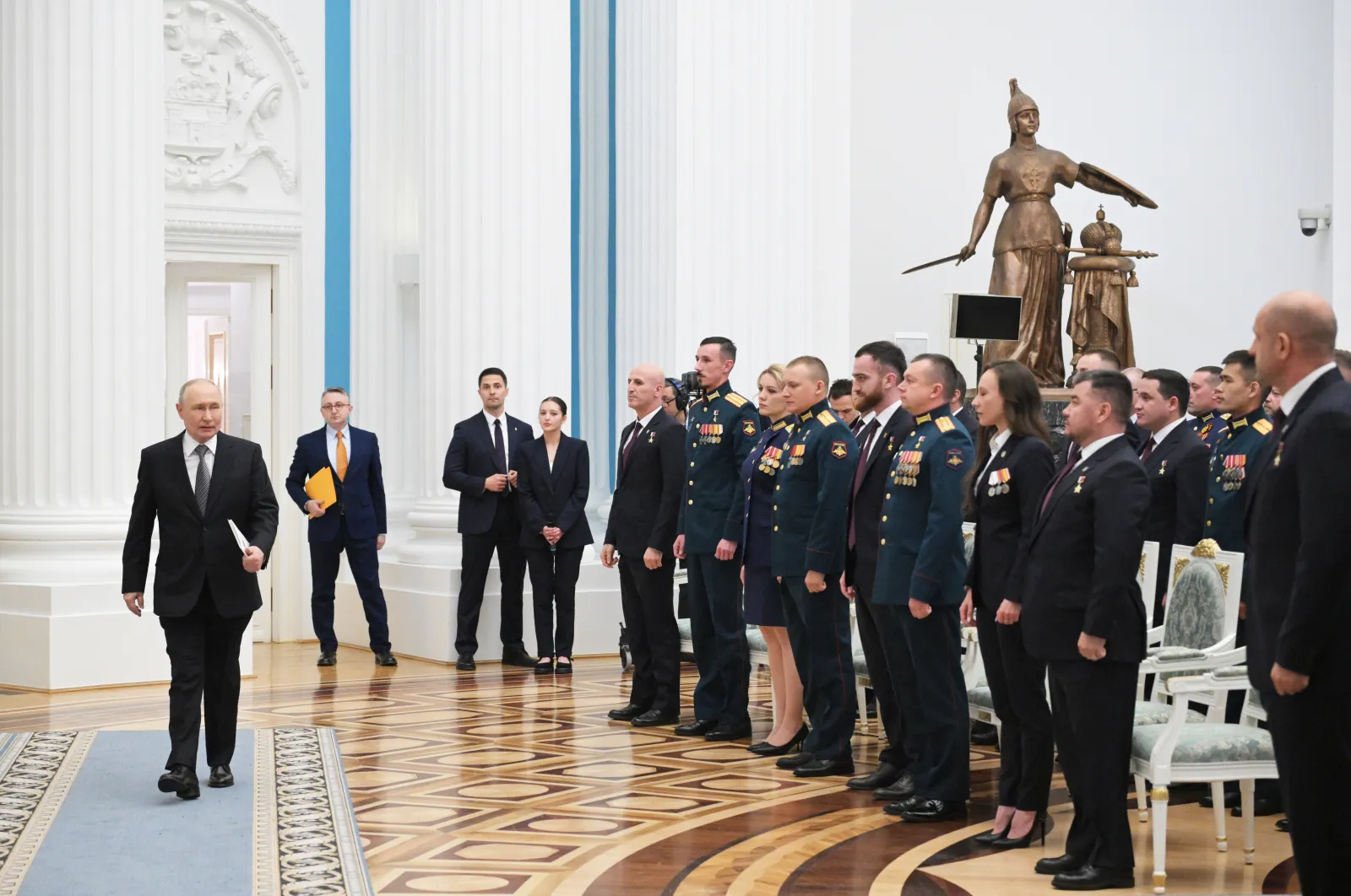 Russian President Vladimir Putin arrives to attend a meeting with participants in the Time of Heroes educational programme for training veterans of the special