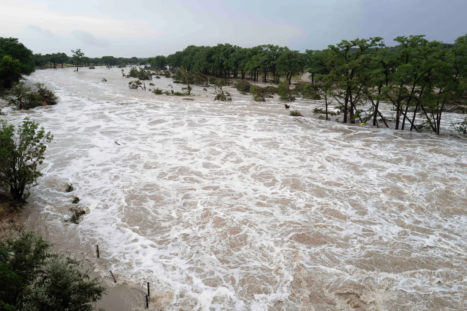 The Guadalupe River in downtown Kerrville, Texas, is seen rising from heavy rains up stream on July 16. Mario Cantu/CSM(Credit Image: © Mario Cantu/Cal Sport Me