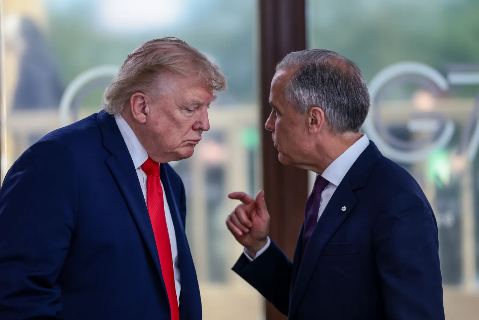 President Donald Trump speaks with Canadian Prime Minister Mark Carney at a working lunch with leaders of G7 and the Middle East in Evian-les-Bains, France, on June 16. (Evelyn Hockstein/Pool Photo via AP,File)