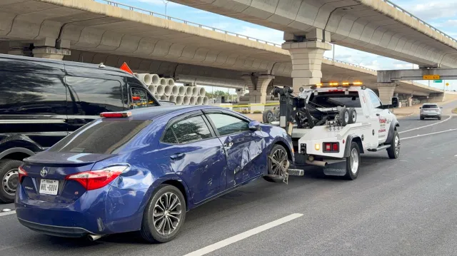 Police move a car from the area where an ICE officer shot Wilber Rafael Garces Perez in Austin, Texas, on Sunday, September 20, 2026.