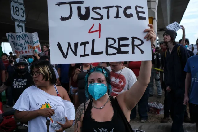 People are seen during a demonstration where Wilber Rafael Garces Perez was shot in his vehicle by an ICE officer on Sunday, September 20, 2026, in Austin, Texas.
