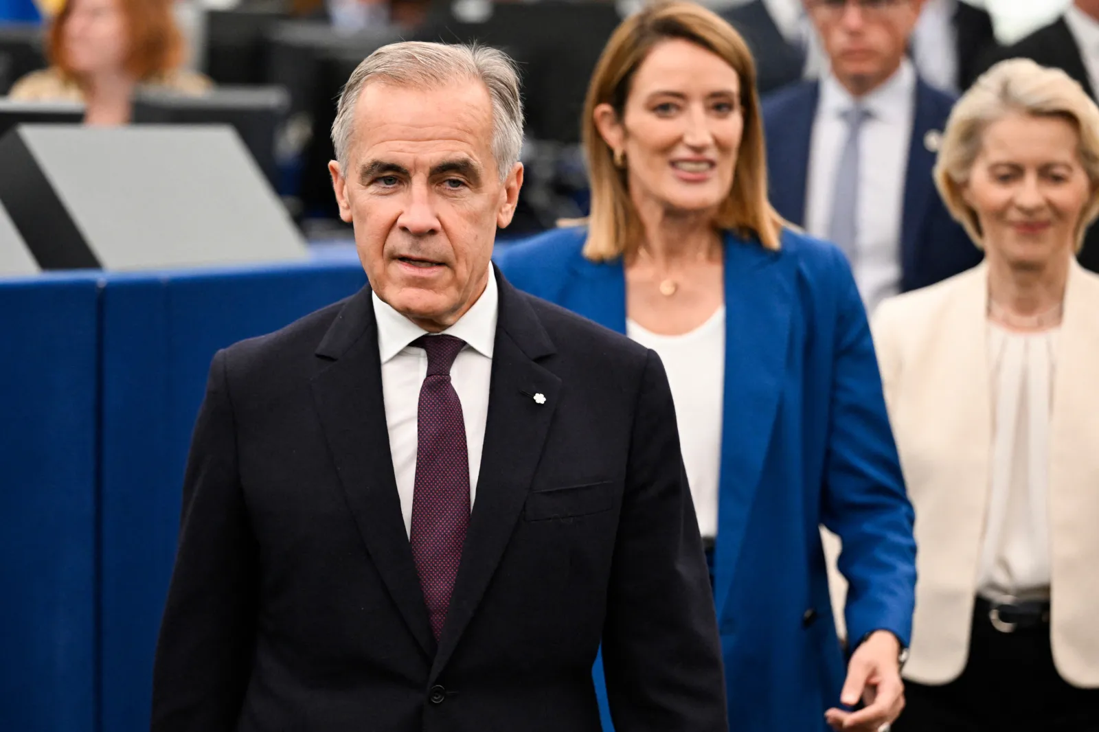 Canada's Prime Minister Mark Carney, EU Parliament President Roberta Metsola and European Commission President Ursula von der Leyen arrive for a speech during E