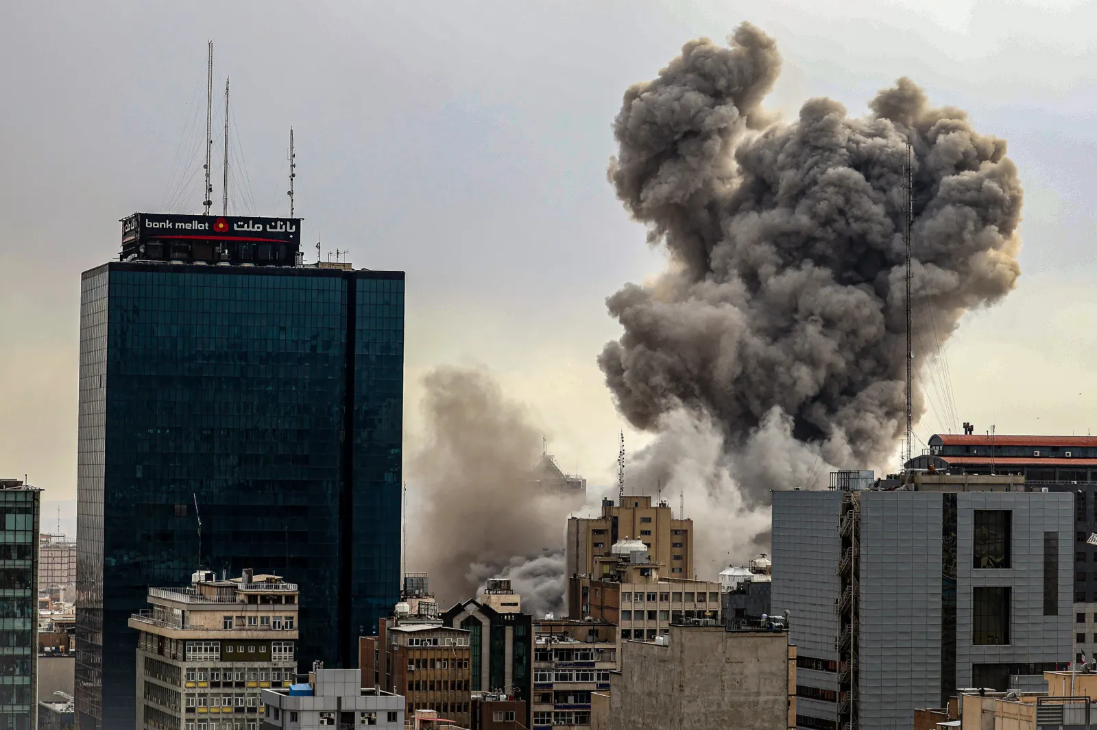 A general view of Tehran with smoke visible in the distance after explosions were reported in the city, on March 02, 2026 in Tehran, Iran.