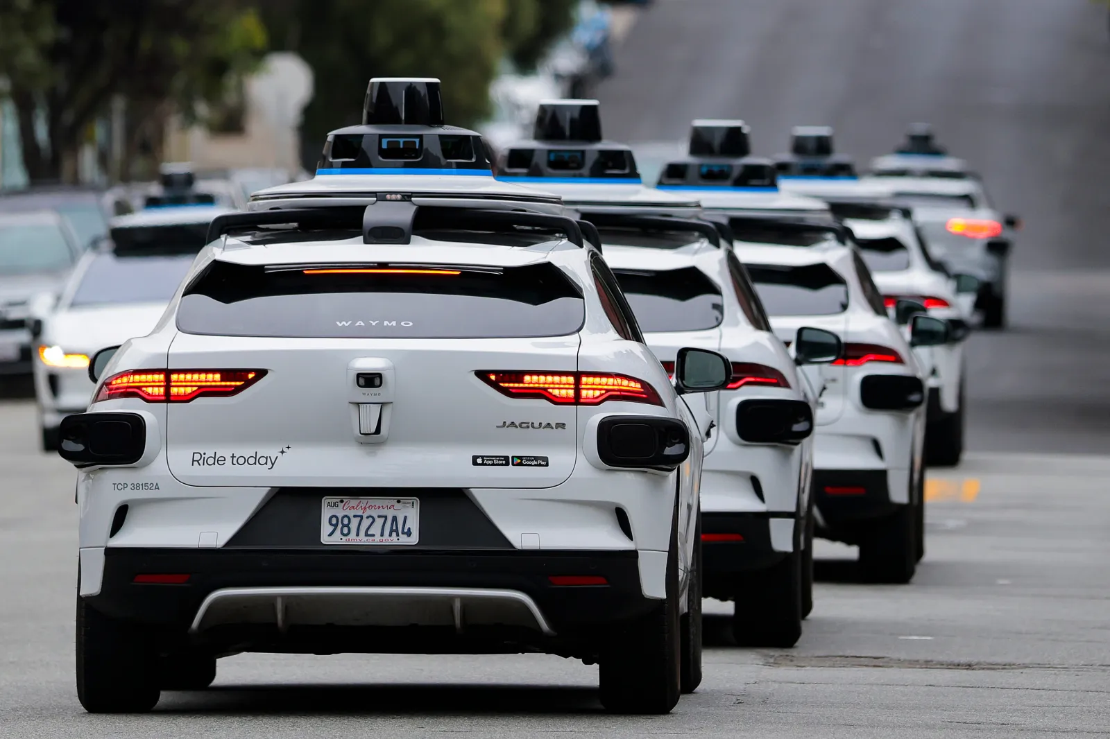 File photo: a line of Waymo robotaxis drives through North Beach on July 7, 2026 in San Francisco, California.