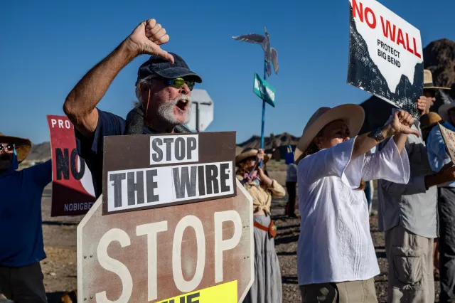 People protest the plans by US President Donald Trump's administration to build a section of the border wall at the Big Bend National Park in Study Butte, Texas, on August 15, 2026.
