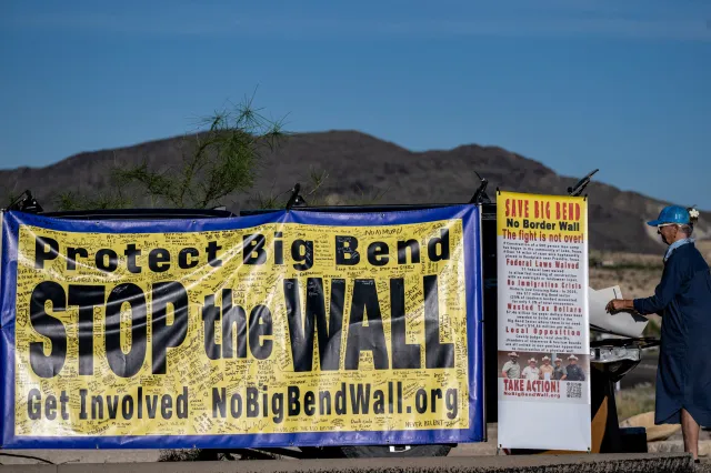 People protest the plans by US President Donald Trump's administration to build a section of the border wall at the Big Bend National Park in Study Butte, Texas, on August 15, 2026.