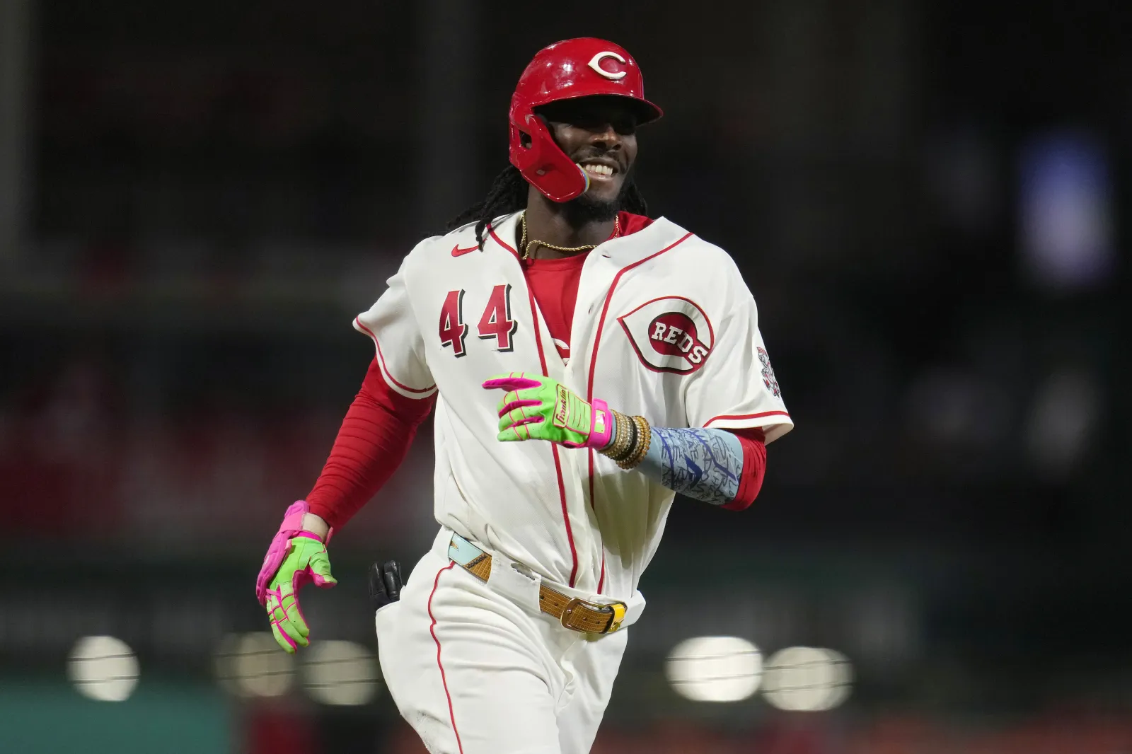 Elly De La Cruz #44 of the Cincinnati Reds gestures as he rounds the bases after hitting a solo home run during the ninth inning of a baseball game against the