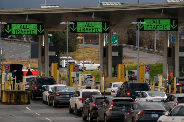 Private vehicles enter the United States from Canada at the Peace Arch border crossing on February 1, 2025, in Blaine, Washington.