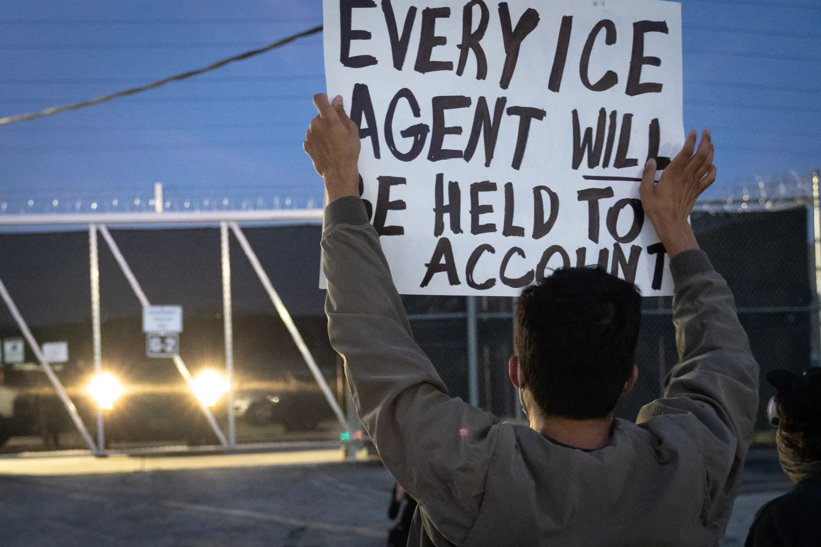 Demonstrators block a driveway outside of an immigration processing center on September 19, 2025, in Broadview, Illinois.