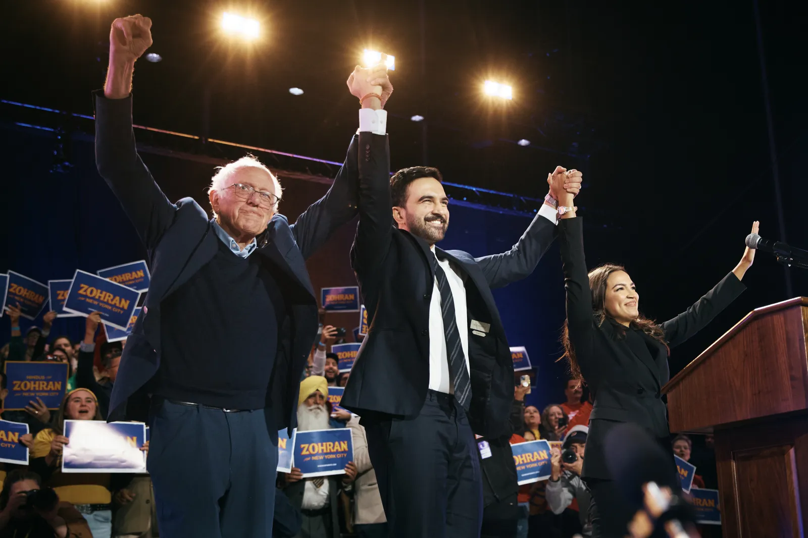 Then-New York City mayoral candidate Zohran Mamdani, center, celebrates with U.S. Senator Bernie Sanders, left, and Representative Alexandria Ocasio-Cortez, right, during an election rally on October 26, 2025, in the Queens borough of New York City. (Photo by Andres Kudacki/Getty Images)