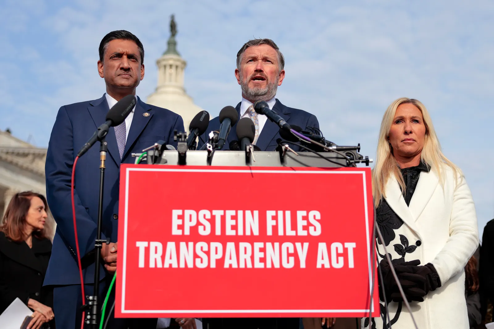 U.S. Rep. Thomas Massie (R-KY) (C) speaks alongside U.S. Rep. Ro Khanna (D-CA) (L) and Rep. Marjorie Taylor Greene (R-GA) during a news conference on the Epstei