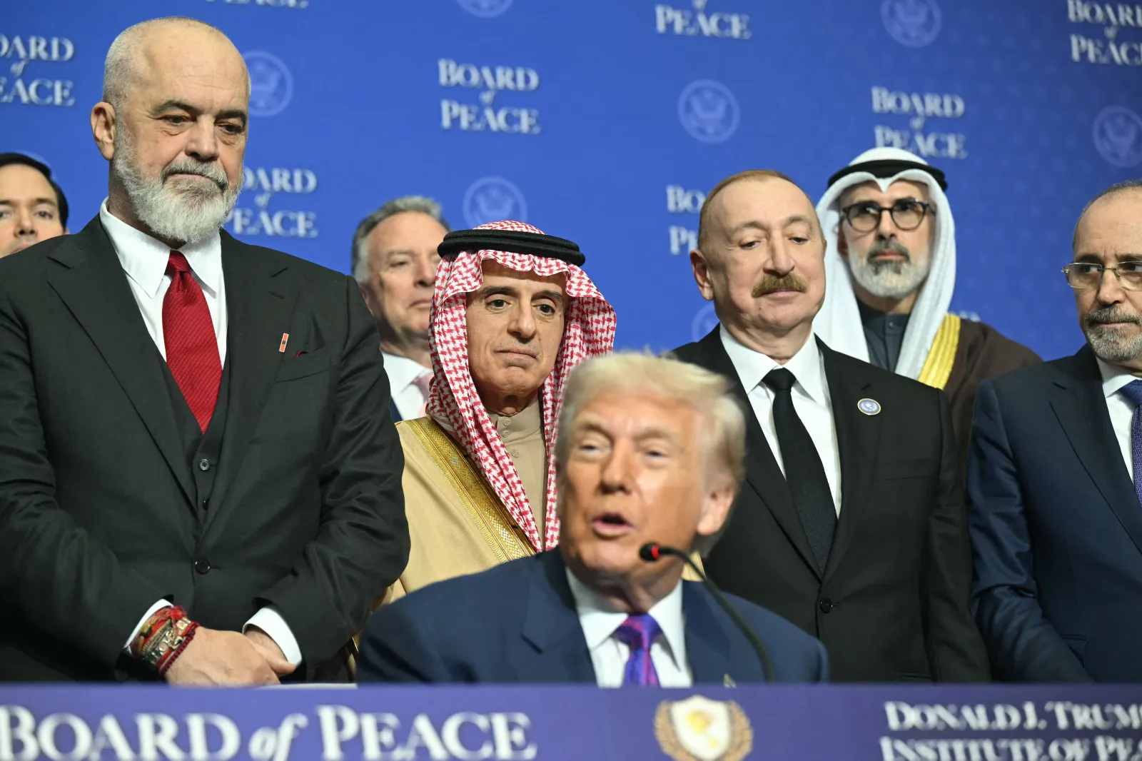Albania's Prime Minister Edi Rama (left) looks on as President Donald Trump speaks at the inaugural meeting of the "Board of Peace" on February 19, 2026, at the