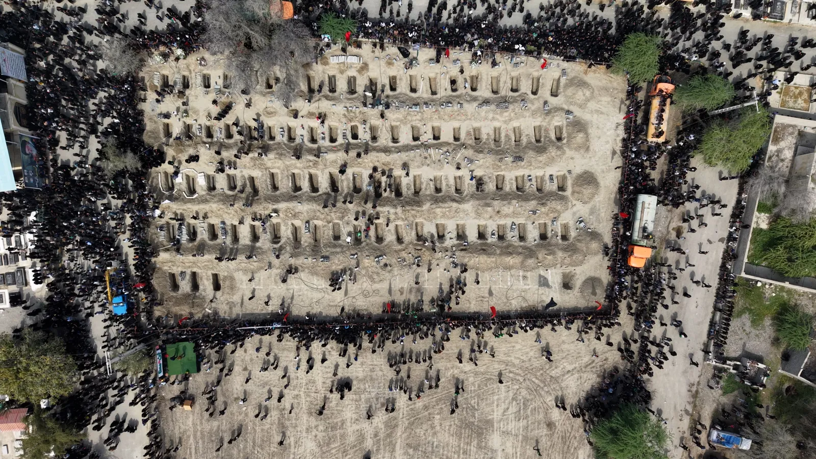 An aerial view of a graveyard as funerals are held for students and staff from a girls' school, who authorities said were killed in a US-Israeli strike on Febru