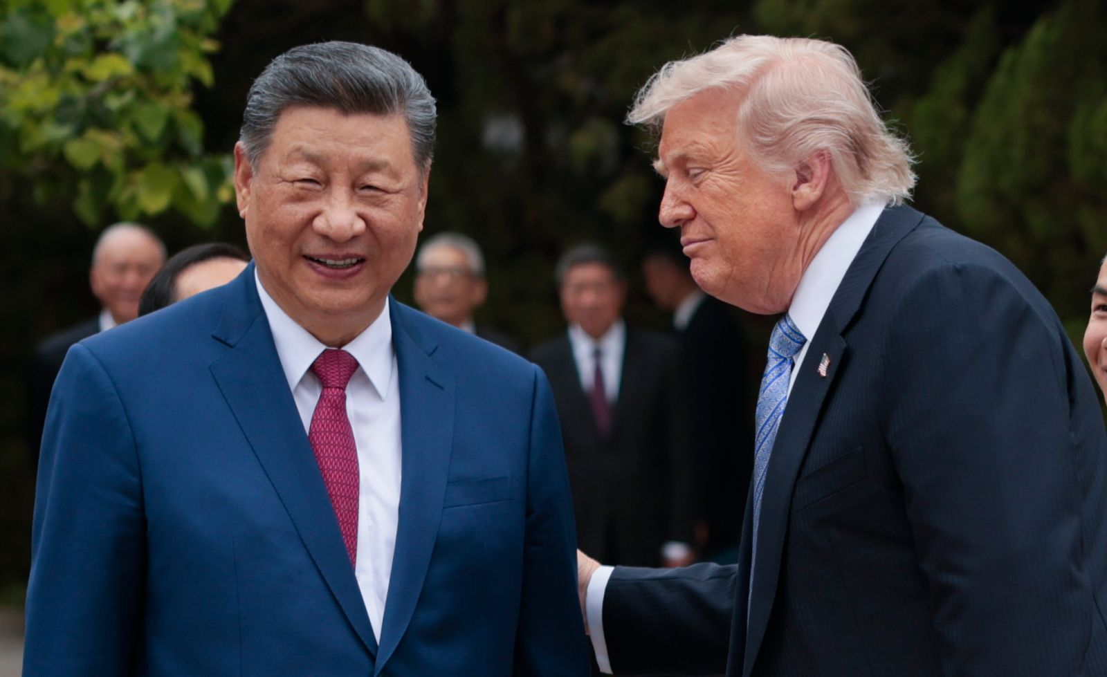 U.S. President Donald Trump speaks with Chinese President Xi Jinping while leaving after a visit to Zhongnanhai Garden on May 15, 2026, in Beijing, China.