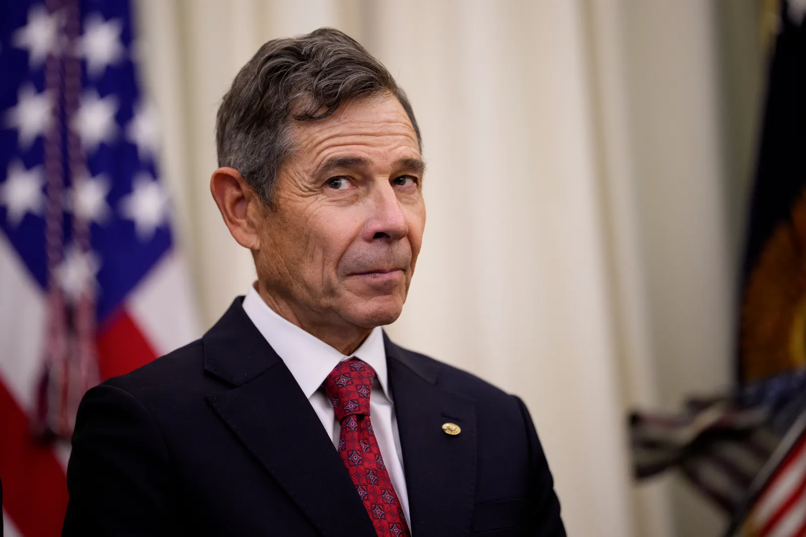 Senator John Curtis appears during an executive order signing with President Trump in the White House on July 13, 2026, in Washington, D.C.