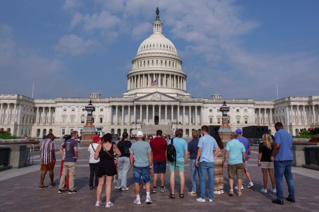 Visitors look at the U.S. Capitol Building on July 20, 2026 in Washington, DC.