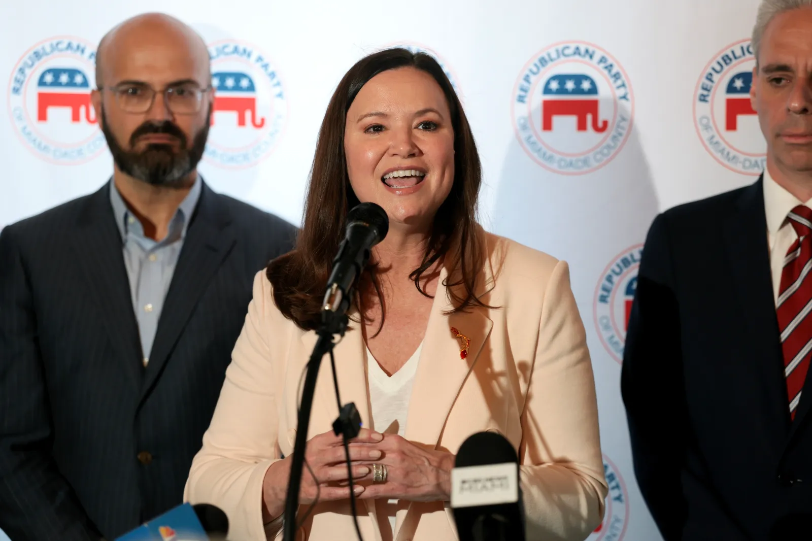U.S. Sen. Ashley Moody (R-FL) speaks to supporters as she campaigns at Sergio's restaurant on August 21, 2026, in Miami, Florida. Moody is facing off against De
