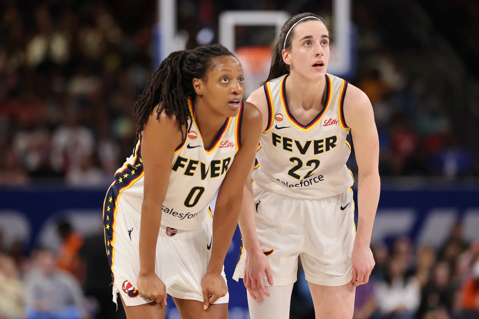 Kelsey Mitchell and Caitlin Clark chat during Fever game against Chicago Sky