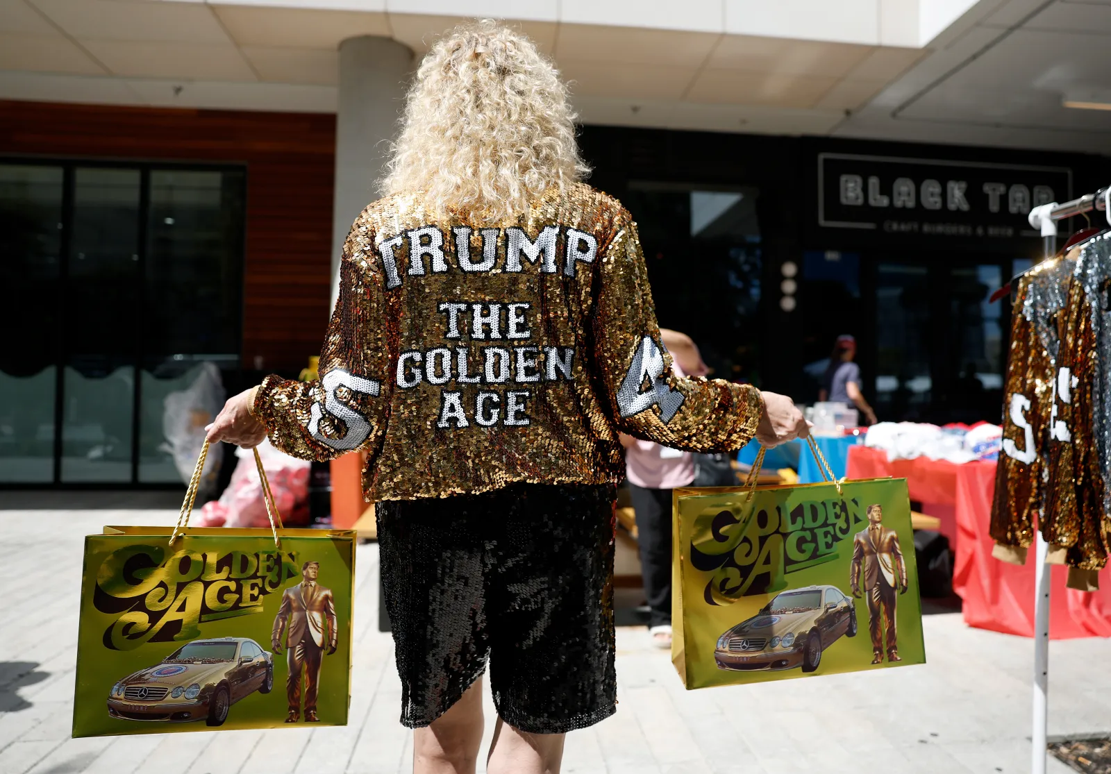 A Trump supporter wears a glitter jacket ahead of the 2026 Republican National Committee (RNC) Midterm Convention at the American Airlines Center on September 8, 2026 in Dallas, Texas.