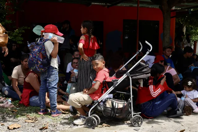 Honduran migrants take a break in a caravan toward the United States in Ciudad Hidalgo, Mexico, on September 24, 2026.